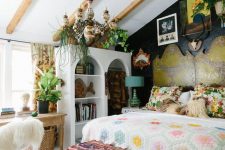 an eclectic bedroom with a bed and a statement headboard, bright textiles, a storage unit, a vintage desk, a fluffy chair and greenery