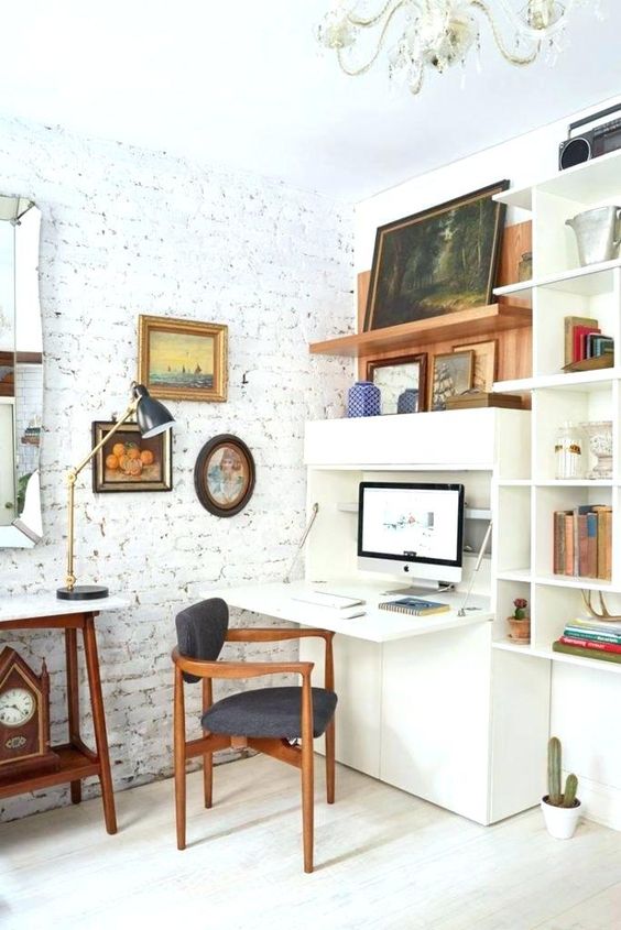 an eclectic space with a storage unit and a built-in Murphy desk that can be hidden any time