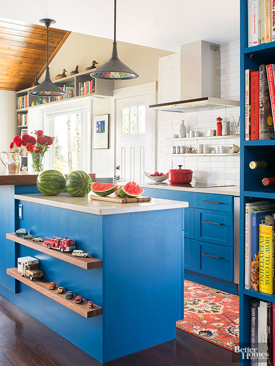 bright sky blue paint on traditional Shaker style cabinets and a variety of finishes make this eclectic kitchen appealing