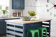 warehouse pallets and green metal stools are paired with vintage-inspired navy cabinets and butcherblock countertops