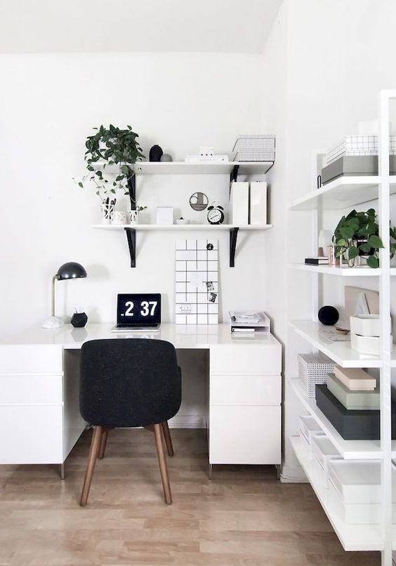 a monochromatic white home office done in Scandinavian style, with just touches of black for more eye-catchiness