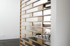 04 a sheer wooden screen is a cool way to separate the spaces with style and without any bulky looks