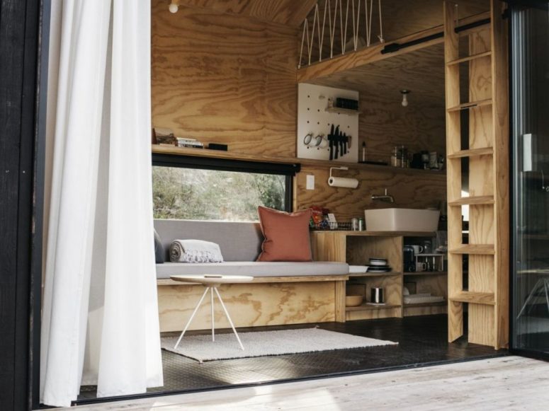 The furniture is minimalist and built-in, it's very functional, and the cabin itself is very small to inspire to spend more time outdoors