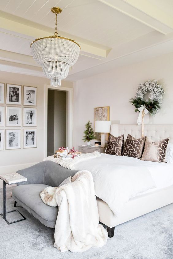 a grey loveseat with a curvy back matches the glam and chic bedroom in neutrals and adds a subtle touch of color