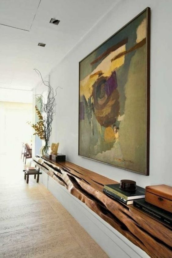 a floating console made of a single wooden slab with a live edge is a great statement in your interior