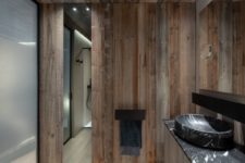 The same reclaimed wood was even used on some of the bathroom walls as a way of maintaining a cohesive look throughout the house