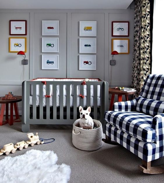 a plaid rocker chair and geometric print curtains add interest and coziness to the light grey nursery