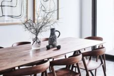 08 a sleek wooden dining table with curved wooden chairs for a contemporary dining space