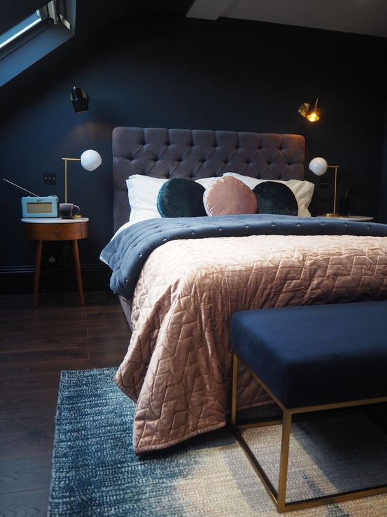 a moody bedroom done with navy and greys plus soft pastel touches is a great idea for those who love sleeping in darker spaces