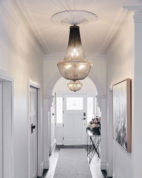 a couple of gorgeous and stylish chandeliers will add chic and charm to your entryway