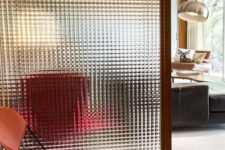 12 a glass screen is a neutral and not too bulky space divider for a small home