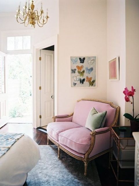 a refined pink loveseat with gold framing is a great idea to use that awkward nook in your bedroom