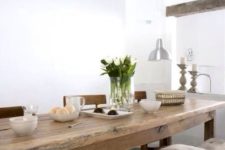 12 a rustic dining table is long and can accommodate a lot of guests, a long bench will let them all sit comfortably