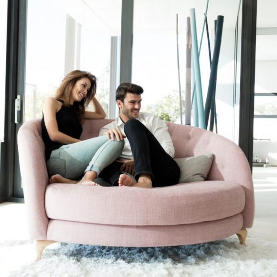 a rounded pink loveseat with tufted upholstery is a cute and attractive idea for any of your spaces