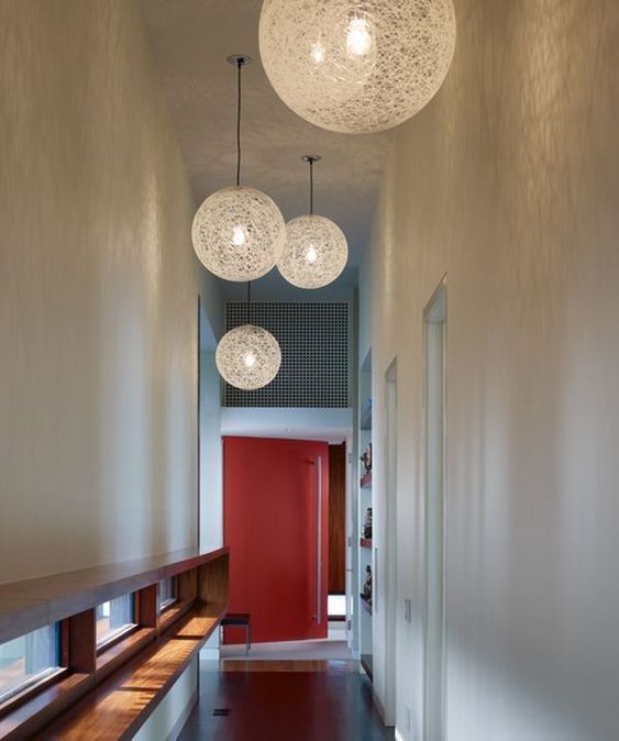 contemporary woven pendant lamps finish off the space and bring enough light to the hallway
