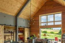 15 a contemporary and sleek barndominium space with a supporting metal construction and wood all around