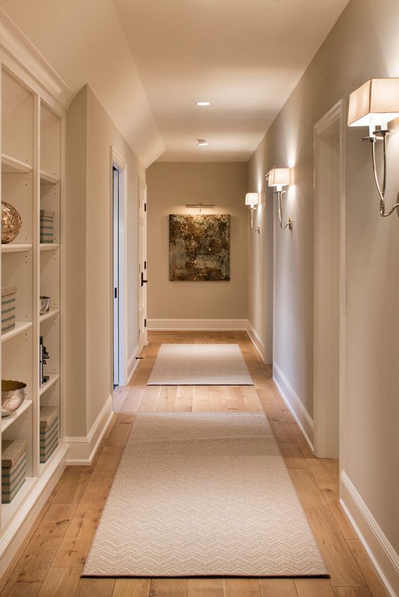 contemporary wall sconces and some built-in lights create a cozy and soothing ambience