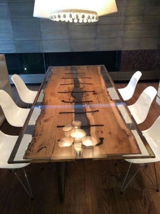 a contemporary dining table with antique wooden planks integrated into resin for a fresh look