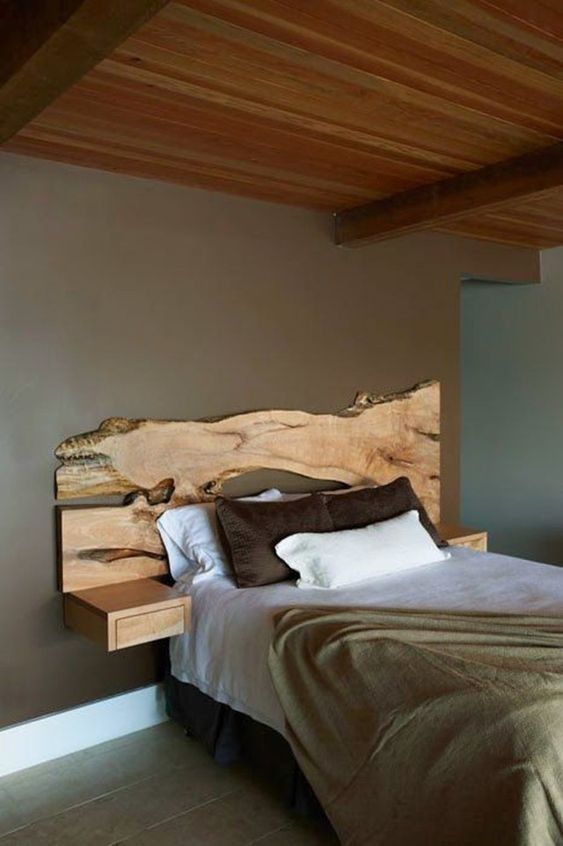 A live edge headboard makes a statement and sleek wall mounted nightstands seem to continue the piece