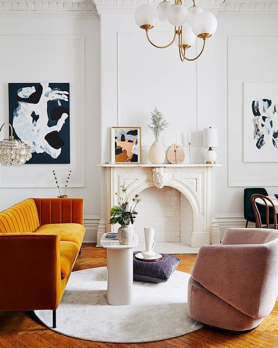 A more contemporary version of a fireplace matches the mid century modern Parisian living room