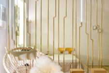 24 a minimalist room divider of wood and gilded metal plus lights looks really wow