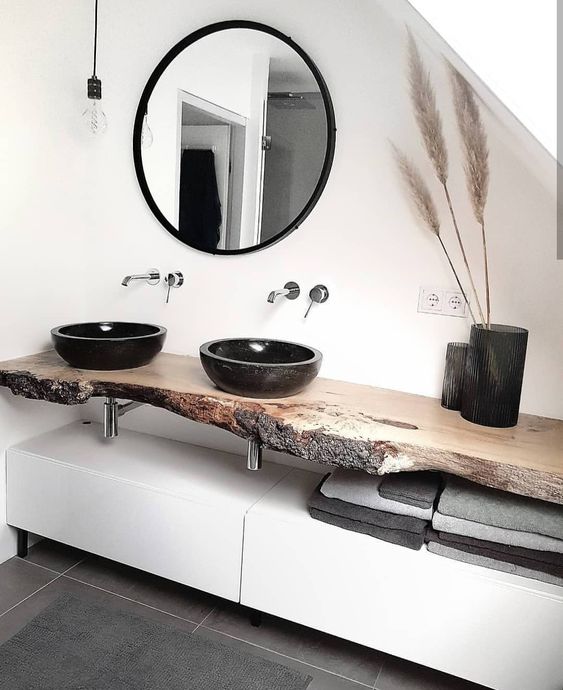 Enliven your minimalist bathroom with a live edge vanity, and if you need a closed storage unit, make a sleek cabinet underneath