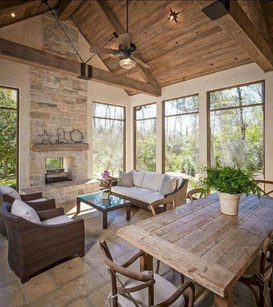 A cozy barndominium space done in neutral colors and all natural materials, stylish wood and wicker furniture
