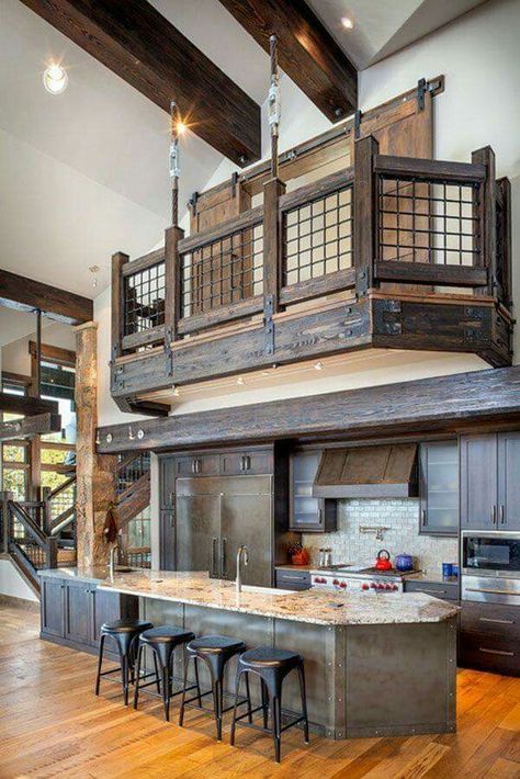a barndominium with dark stained wood and stone countertops, high ceilings with beams create an airy feeling in the space