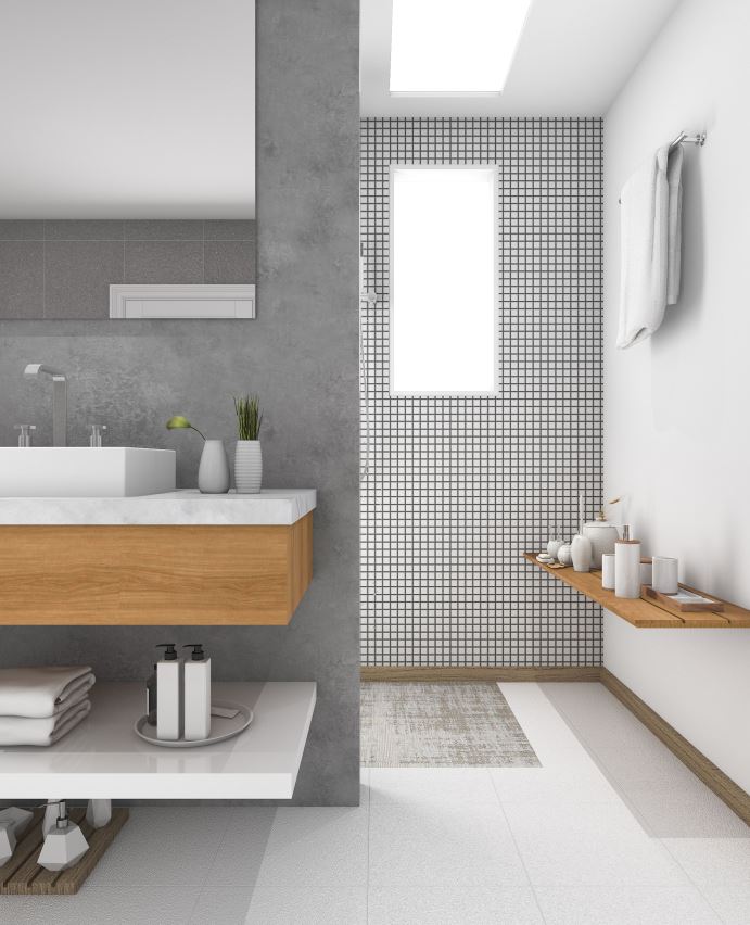 A neutral transitional bathroom done in off whites and greys and light colored wooden touches that add warmth to the space