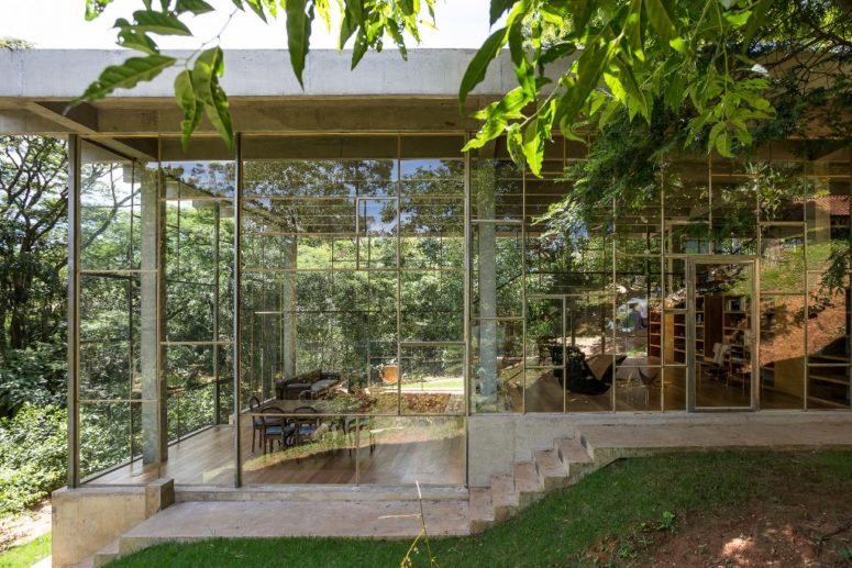 This concrete and glass contemporary home is right in the middle of Atlanti Rainforest and it was built for a philosopher to enjoy views and look at the stars