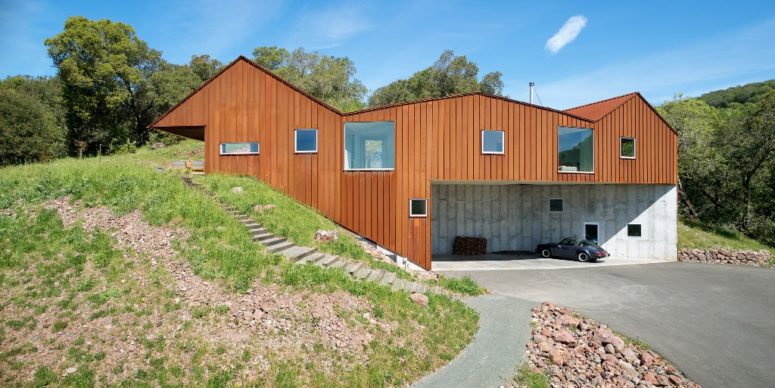 The house is built into a steep slope and looks natural in the surroundings