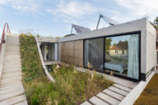 02 The house is built of concrete, with glazed walls and photovoltaic panels