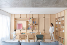 02 The living room is united with a dining space, there are lots of light-colroed plywood cabinets for storage