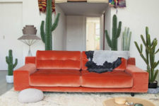 02 a chic orange velvet sofa makes a bold statement in the boho desert living room and becomes a centerpiece