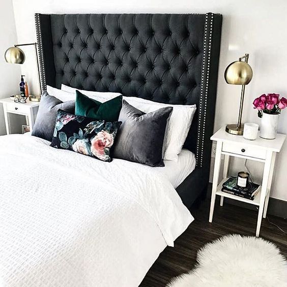 a black tall diamond upholstery headboard with nail trim is a bold and chic statement with a touch of drama