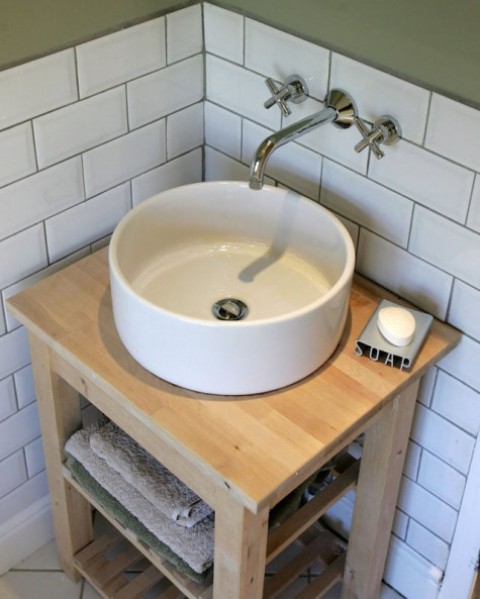 an Ikea Bekvam kitchen cart and Tornviken countertop sink turned into a chic rustic vanity with a bowl sink