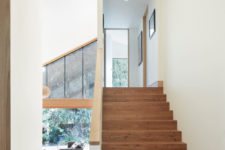 04 A simple wooden staircase leads upstairs to sleeping zones