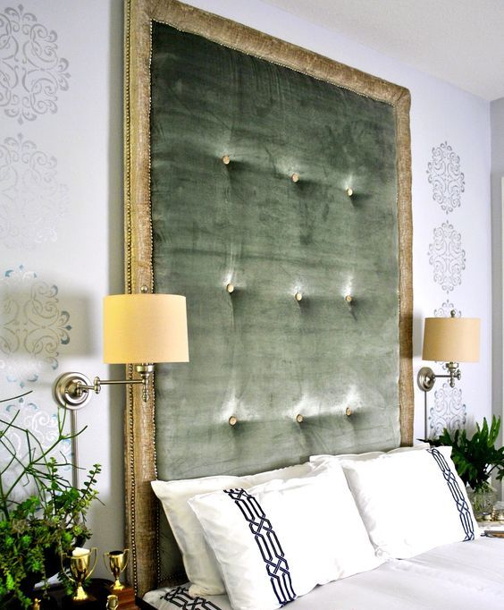 a statement green tufted headboard with gold framing is a stylish idea with a refined feel