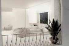 05 The bedroom is very dreamy and I like how lights are placed here, there’s a minimalist platform bed and a potted plant