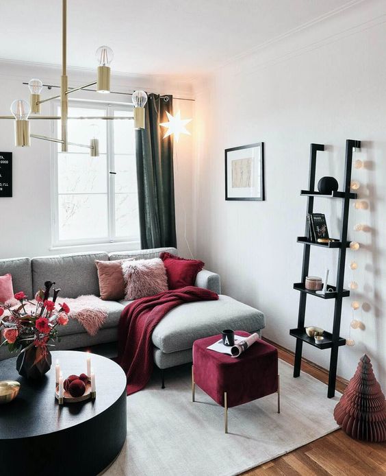 A glam chandelier, a garland of lights and a bold star shaped hanging lamp for illuminating the space