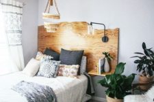 06 a live edge headboard with floating nightstands and a single lamp attached is a cool idea with a boho feel