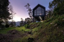 07 The minimalist house extends over the rugged terrain, overlooking the two valleys which frame it