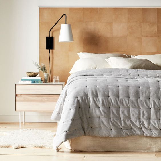 a stylish leather square headboard is a chic and warmign up idea that can be easily DIYed by you