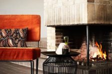 09 a bold orange velvet chair with hairpin legs brings mid-century modern chic and a fall touch to the space