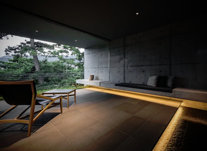 The living room looks moody and relaxing, as if you are in a spa