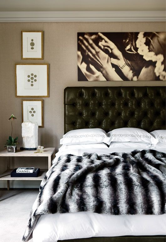 a black leather tufted headboard for a chic and elegant touch to this refined sleeping space