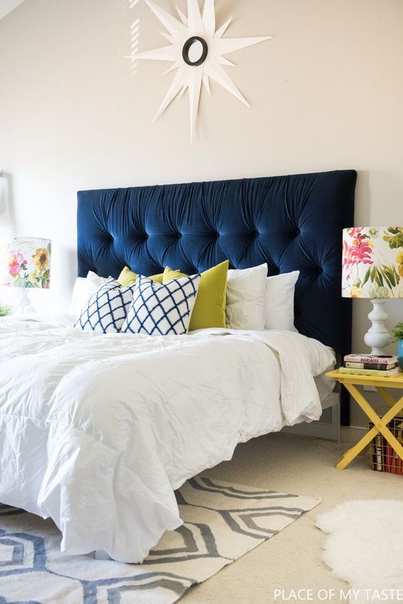 a navy tufted headboard is a bold statement in the neutral bedroom and a chic and timeless decor idea