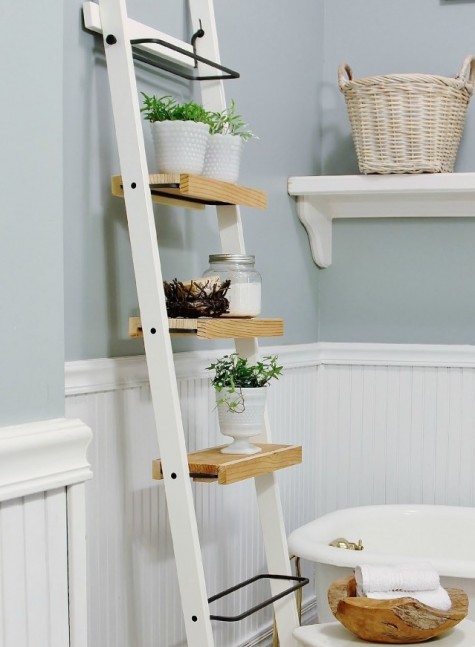 a space-saving ladder storage unit made of Ikea towel holders and some wood on them