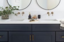 11 elegant brass and glass bubble lights over the vanity and over the sinks are great tasking lights