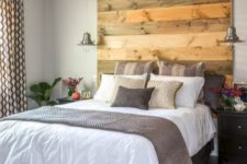 12 a reclaimed wood headboard coming up to the ceiling makes a statement and adds texture